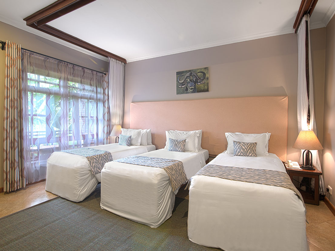 Airport-Planet-Lodge-Family-room-2-Triple-Room-with-3-single-beds-TANZANIA SAFARI