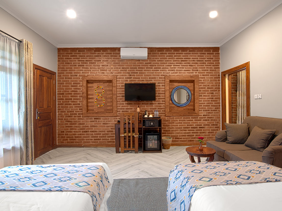 Airport-Planet-Lodge_-Brick-wall-decor-in-deluxe-room- TANZANIA SAFARI